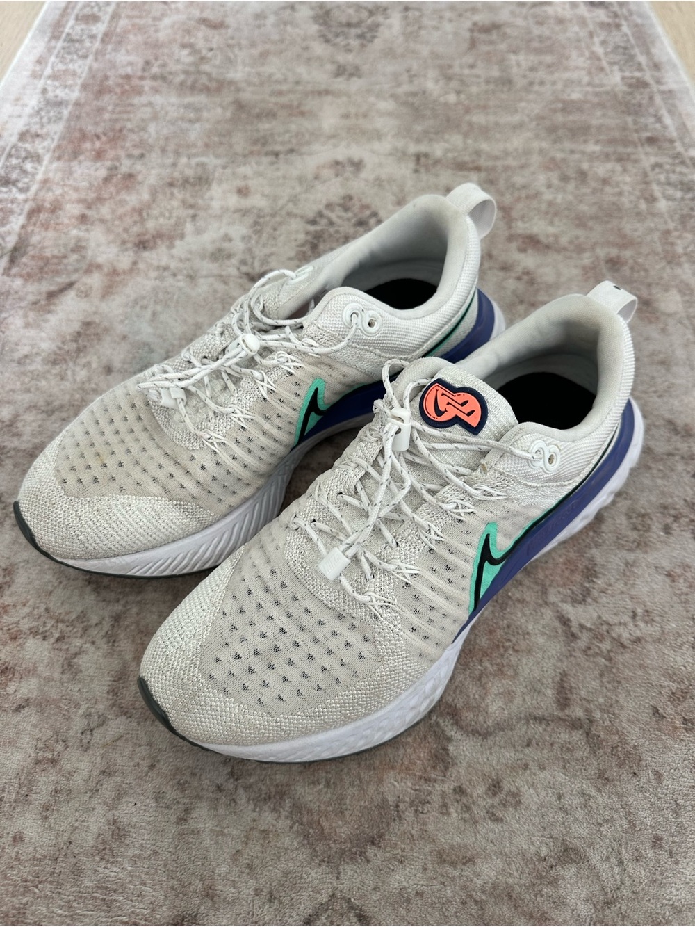 Nike Women's Light Gray Running Sneakers with Teal and Purple Accents